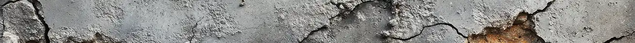 Freeze-thaw damage in concrete showing surface cracks, scaling, and structural deterioration caused by internal ice expansion
