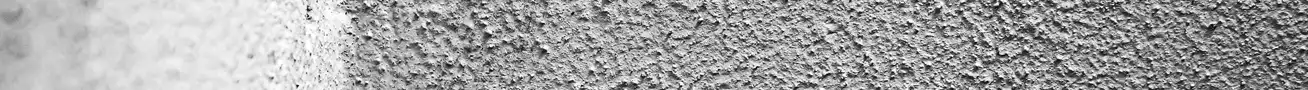 Concrete with visible moisture infiltration and internal cracking caused by freeze–thaw damage